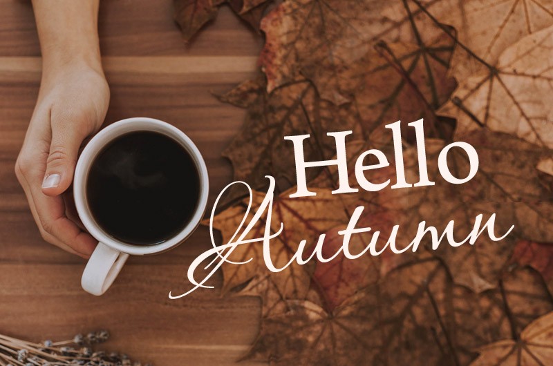 Hello Autumn picture with a hot drink on a beautiful fall background